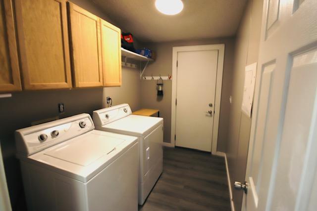 4757 Richlie, Missoula, MT 59808 - laundry room with separate washer and dryer, cabinet space, and dark wood finished floors