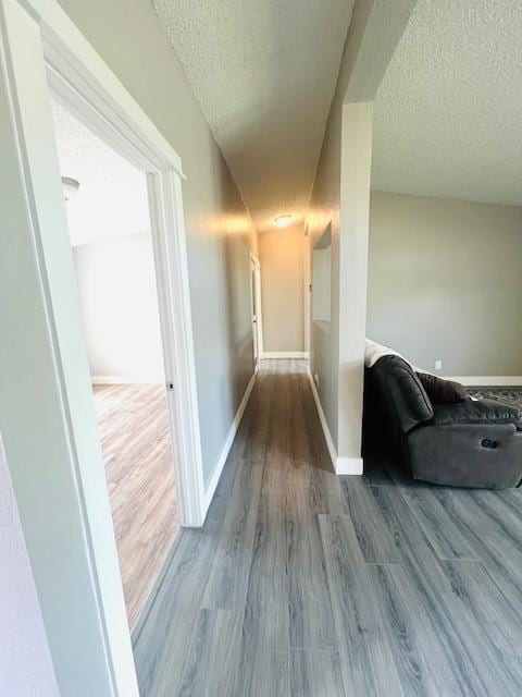 4757 Richlie, Missoula, MT 59808 - hall with a textured ceiling, wood finished floors, and baseboards