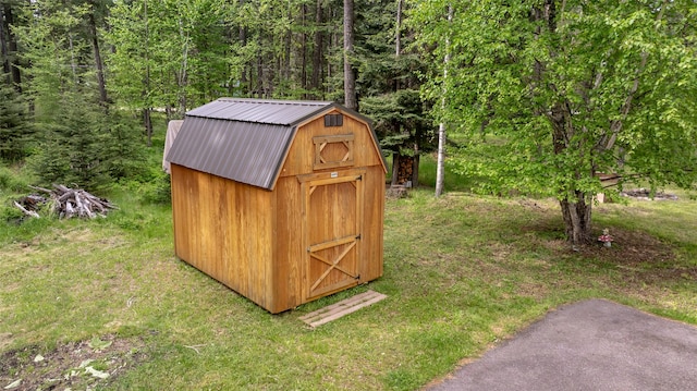 13033 Trinkus Ln, Bigfork, MT 59911 - view of shed featuring a wooded view