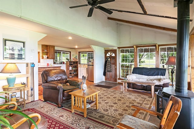 874 Coal Pit Rd, Corvallis, MT 59828 - living area featuring beamed ceiling, a ceiling fan, high vaulted ceiling, wood finished floors, and recessed lighting