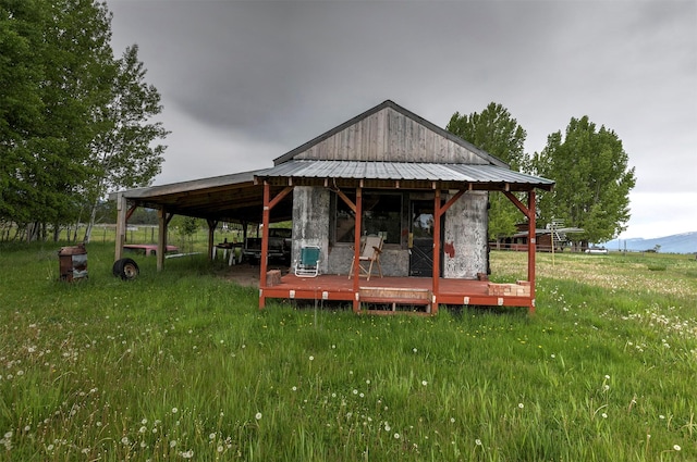 874 Coal Pit Rd, Corvallis, MT 59828 - rear view of property with metal roof and a mountain view