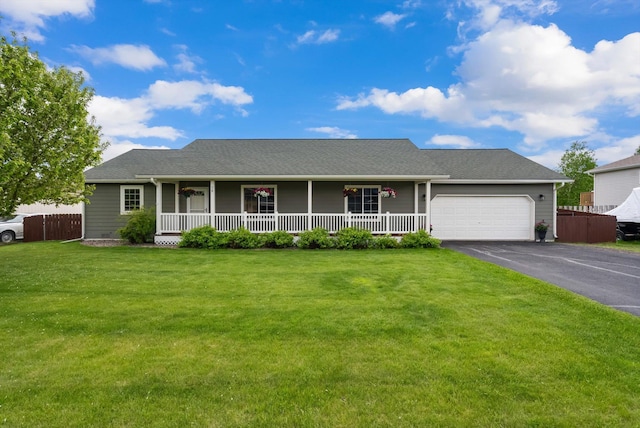28 Bethany St, Columbia Falls, MT 59912 - view of front of home featuring covered porch, driveway, and an attached garage