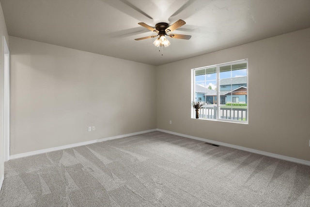 28 Bethany St, Columbia Falls, MT 59912 - carpeted spare room featuring baseboards and ceiling fan