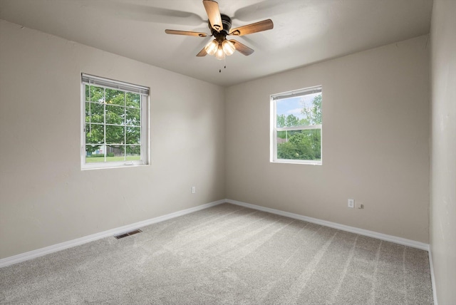 28 Bethany St, Columbia Falls, MT 59912 - spare room with healthy amount of natural light, light carpet, and baseboards