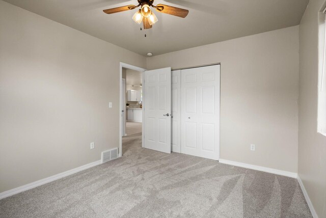 28 Bethany St, Columbia Falls, MT 59912 - unfurnished bedroom featuring carpet, baseboards, a closet, and a ceiling fan