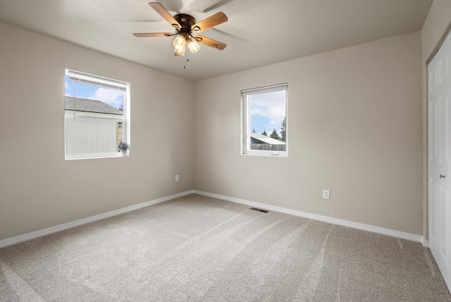 28 Bethany St, Columbia Falls, MT 59912 - empty room featuring light colored carpet, baseboards, and a ceiling fan