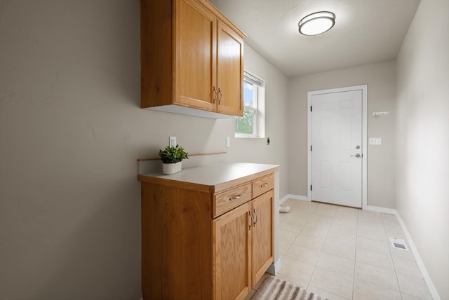 28 Bethany St, Columbia Falls, MT 59912 - laundry area featuring baseboards and light tile patterned floors