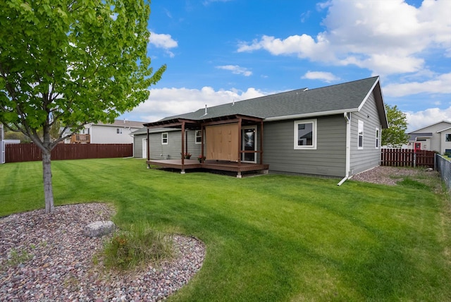 28 Bethany St, Columbia Falls, MT 59912 - back of property featuring a wooden deck and a shingled roof