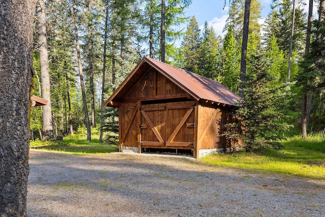 131 Mccaffery Lookout Trl, Bigfork, MT 59911 - view of outdoor structure with a wooded view