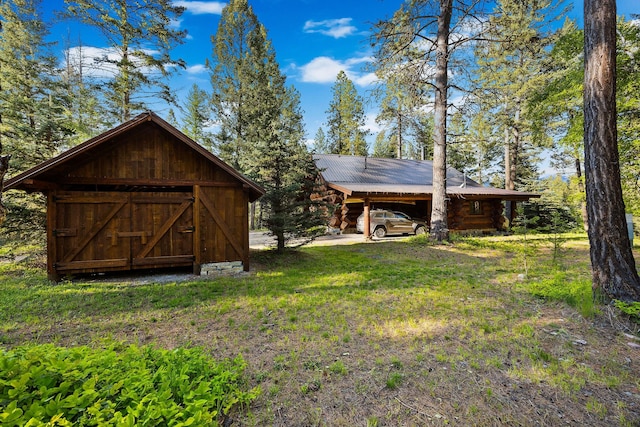 131 Mccaffery Lookout Trl, Bigfork, MT 59911 - view of outbuilding with a carport