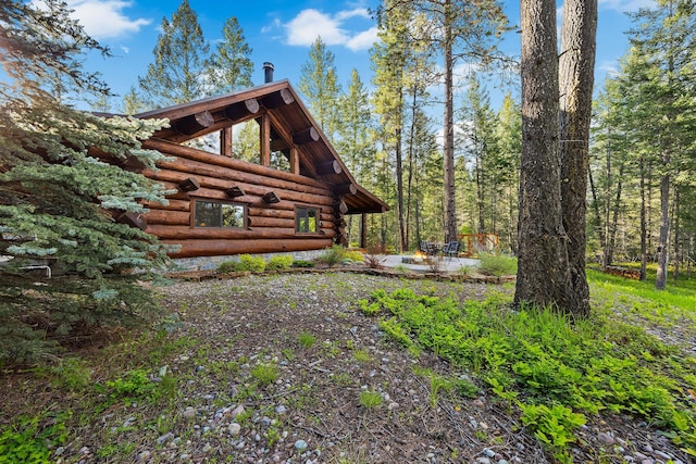 131 Mccaffery Lookout Trl, Bigfork, MT 59911 - view of side of property with log siding