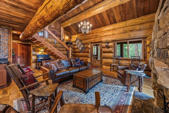 131 Mccaffery Lookout Trl, Bigfork, MT 59911 - living room with wood ceiling, rustic walls, stairs, hardwood / wood-style floors, and a chandelier