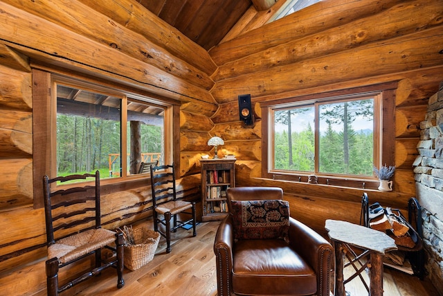 131 Mccaffery Lookout Trl, Bigfork, MT 59911 - sitting room with lofted ceiling, wooden ceiling, wood finished floors, and plenty of natural light