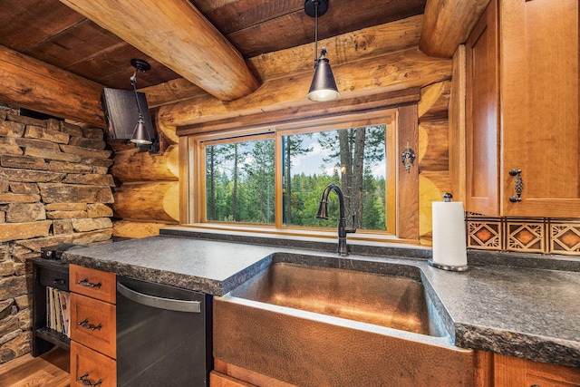 131 Mccaffery Lookout Trl, Bigfork, MT 59911 - kitchen with a sink, log walls, stainless steel dishwasher, dark countertops, and wood ceiling with exposed beams