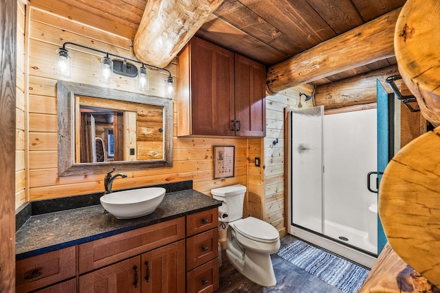 131 Mccaffery Lookout Trl, Bigfork, MT 59911 - bathroom with wooden ceiling with exposed beams, a stall shower, vanity, toilet, and wood finished floors