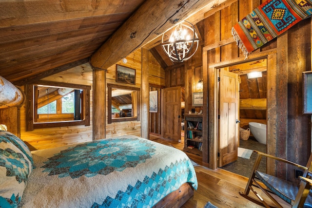 131 Mccaffery Lookout Trl, Bigfork, MT 59911 - bedroom with wood walls, hardwood / wood-style flooring, a chandelier, and wooden ceiling