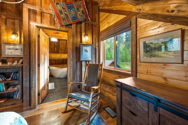 131 Mccaffery Lookout Trl, Bigfork, MT 59911 - sitting room with wood walls and wood-type flooring