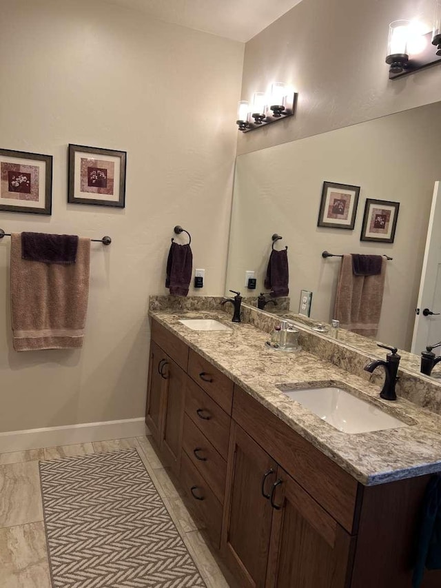 2669 Bunkhouse Pl, Missoula, MT 59808 - bathroom featuring double vanity and baseboards