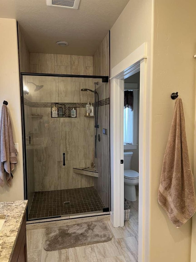 2669 Bunkhouse Pl, Missoula, MT 59808 - full bathroom with toilet, a stall shower, and marble finish flooring