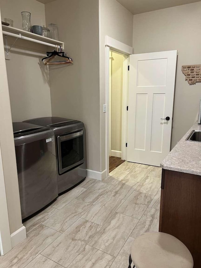 2669 Bunkhouse Pl, Missoula, MT 59808 - laundry room with washer and dryer and baseboards