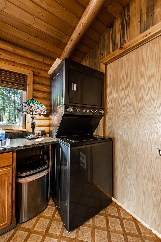 204 Cougar Meadow Dr, Saint Regis, MT 59866 - kitchen featuring rustic walls, wooden ceiling, dark countertops, and brown cabinets