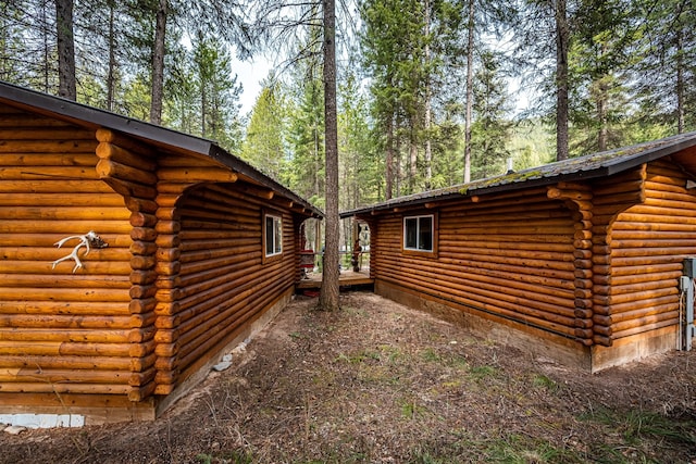 204 Cougar Meadow Dr, Saint Regis, MT 59866 - view of home's exterior with log siding and a deck