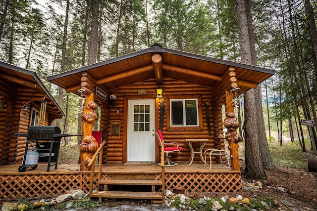 204 Cougar Meadow Dr, Saint Regis, MT 59866 - property entrance with log exterior and a deck