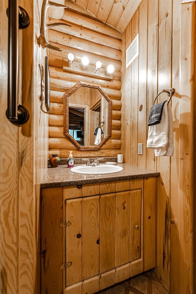 204 Cougar Meadow Dr, Saint Regis, MT 59866 - bathroom featuring rustic walls, vanity, and wood ceiling
