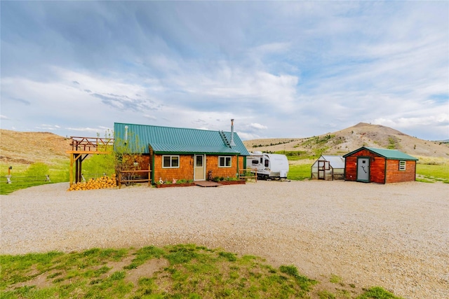34 Outlaw Trl, Anaconda, MT 59711 - view of front of home with a mountain view and metal roof