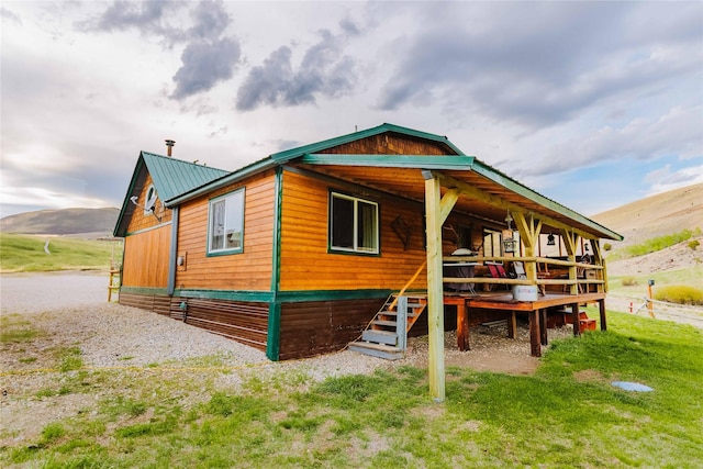 34 Outlaw Trl, Anaconda, MT 59711 - back of house featuring a mountain view and metal roof