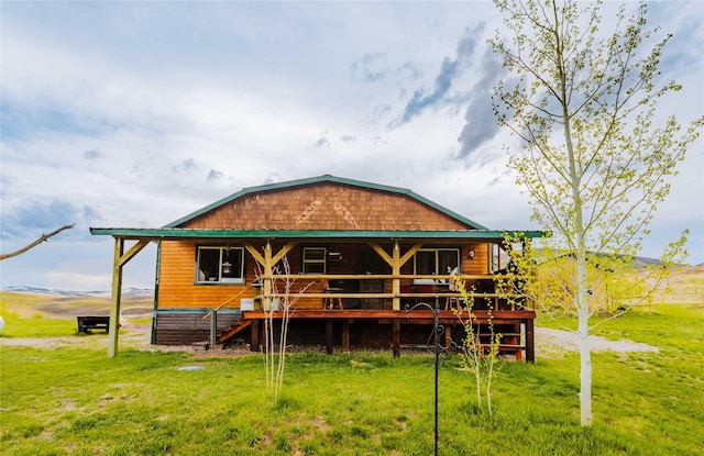 34 Outlaw Trl, Anaconda, MT 59711 - rear view of house featuring a lawn