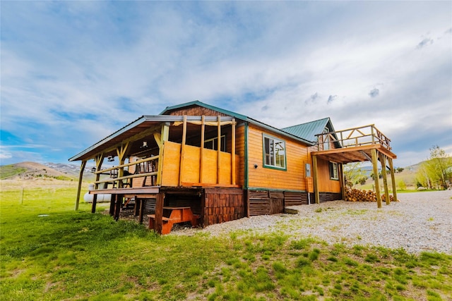 34 Outlaw Trl, Anaconda, MT 59711 - rear view of property featuring metal roof and a deck with mountain view