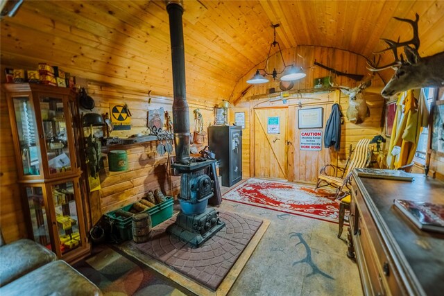 34 Outlaw Trl, Anaconda, MT 59711 - foyer with a wood stove, lofted ceiling, wood ceiling, and wood walls