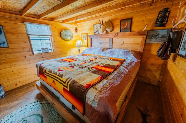 34 Outlaw Trl, Anaconda, MT 59711 - bedroom with wood walls, beam ceiling, and wood finished floors