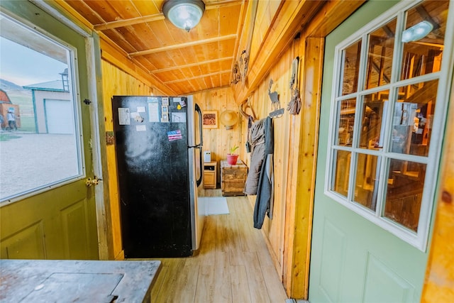 34 Outlaw Trl, Anaconda, MT 59711 - hallway featuring wood ceiling, light wood-type flooring, vaulted ceiling, and wood walls