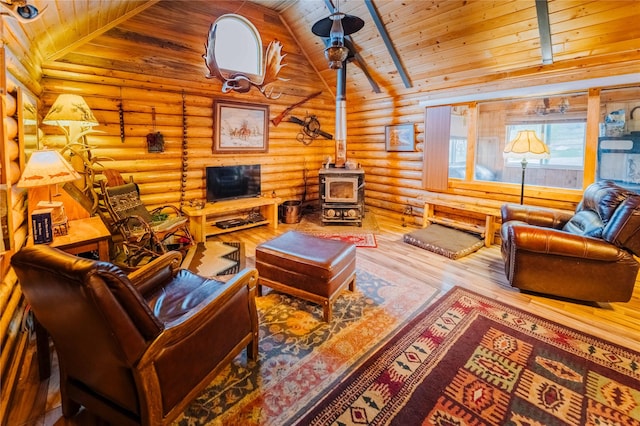 34 Outlaw Trl, Anaconda, MT 59711 - living room featuring wood ceiling, a wood stove, wood-type flooring, log walls, and high vaulted ceiling