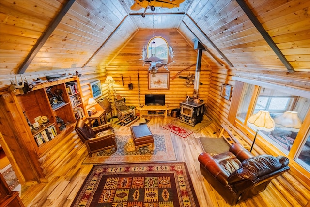 34 Outlaw Trl, Anaconda, MT 59711 - living area with wood ceiling, hardwood / wood-style flooring, vaulted ceiling, a wood stove, and log walls