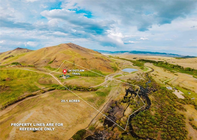 34 Outlaw Trl, Anaconda, MT 59711 - aerial view of property and surrounding area with property boundaries highlighted and mountains