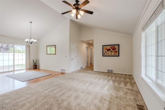 115 River Glen Ct, Kalispell, MT 59901 - unfurnished living room with a ceiling fan, baseboards, a chandelier, ornamental molding, and carpet flooring