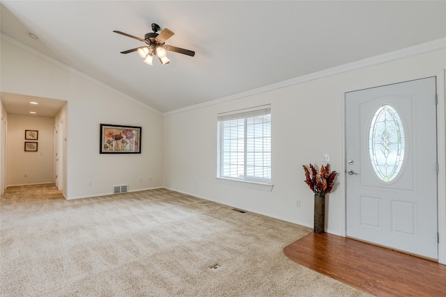 115 River Glen Ct, Kalispell, MT 59901 - carpeted entryway featuring ceiling fan, vaulted ceiling, ornamental molding, and baseboards