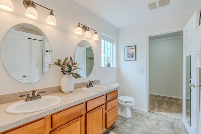 115 River Glen Ct, Kalispell, MT 59901 - bathroom with double vanity, toilet, and ornamental molding