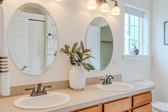 115 River Glen Ct, Kalispell, MT 59901 - bathroom featuring double vanity and toilet