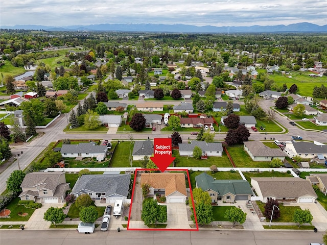 115 River Glen Ct, Kalispell, MT 59901 - aerial view of residential area featuring property boundaries highlighted and a mountain backdrop