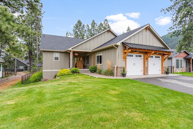 11515 Ninebark Way, Missoula, MT 59802 - view of front of property with an attached garage, board and batten siding, roof with shingles, and asphalt driveway