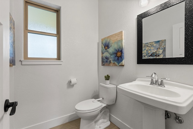 11515 Ninebark Way, Missoula, MT 59802 - half bath with baseboards, toilet, and wood finished floors