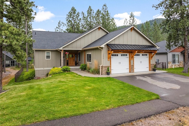 11515 Ninebark Way, Missoula, MT 59802 - view of front of home with a garage, a shingled roof, driveway, covered porch, and board and batten siding