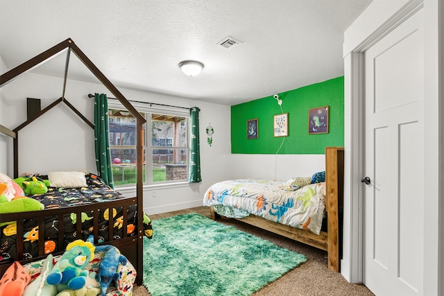 11515 Ninebark Way, Missoula, MT 59802 - bedroom featuring carpet floors, a textured ceiling, and baseboards