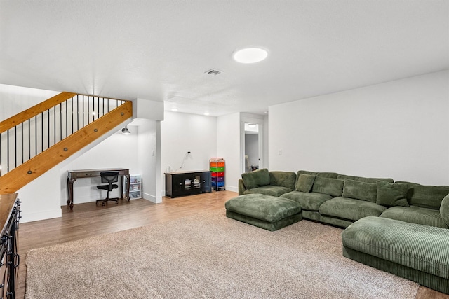 11515 Ninebark Way, Missoula, MT 59802 - living area featuring wood finished floors, stairway, and baseboards