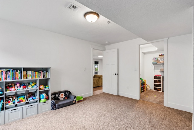 11515 Ninebark Way, Missoula, MT 59802 - rec room featuring carpet flooring, baseboards, and a textured ceiling