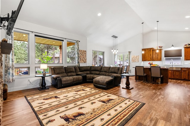 11515 Ninebark Way, Missoula, MT 59802 - living room with wood finished floors, high vaulted ceiling, and recessed lighting
